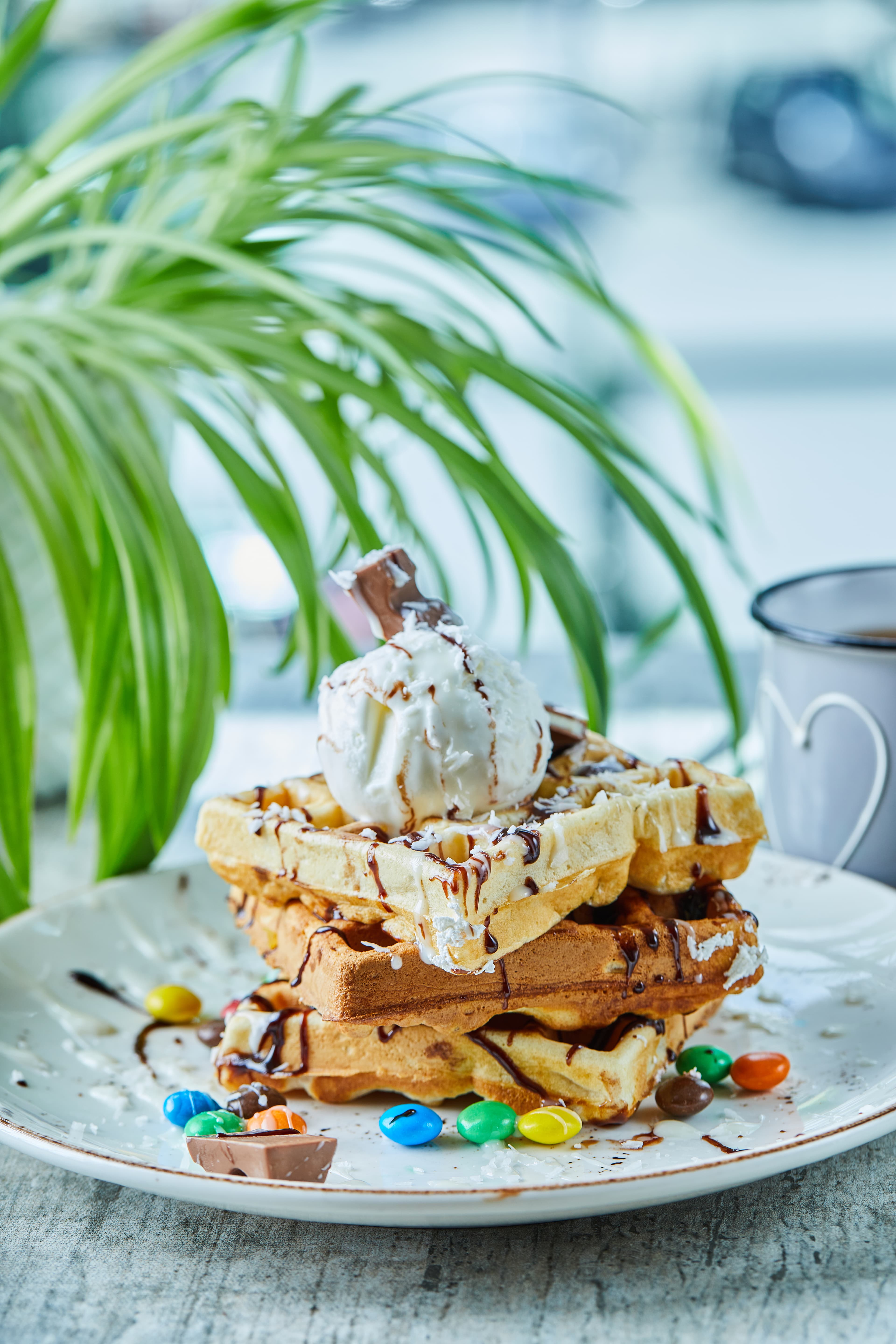 Crepe and waffle dessert with chocolate and fresh toppings